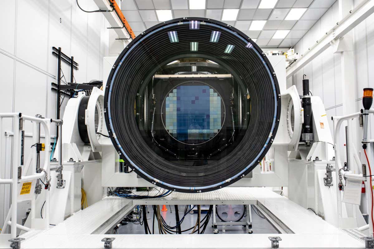 Researchers at SLAC National Accelerator Laboratory are nearly done with the LSST Camera, the world's largest digital camera ever built for astronomy. Roughly the size of a small car and weighing in at three tons, the camera features a five-foot wide front lens and a 3,200 megapixel sensor that will be cooled to -100??C to reduce noise. Once complete and in place atop the Vera C. Rubin Observatory's Simonyi Survey Telescope in Chile, the camera will survey the southern night sky for a decade, creating a trove of data that scientists will pore over to better understand some of the universe's biggest mysteries, including the nature of dark energy and dark matter. (Jacqueline Ramseyer Orrell/SLAC National Accelerator Laboratory)