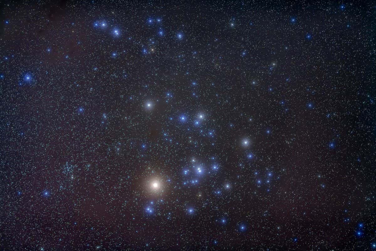 H63XG9 The Hyades open star cluster in Taurus with the bright star Aldebaran, not a part of the cluster iteslf. The smaller and more di