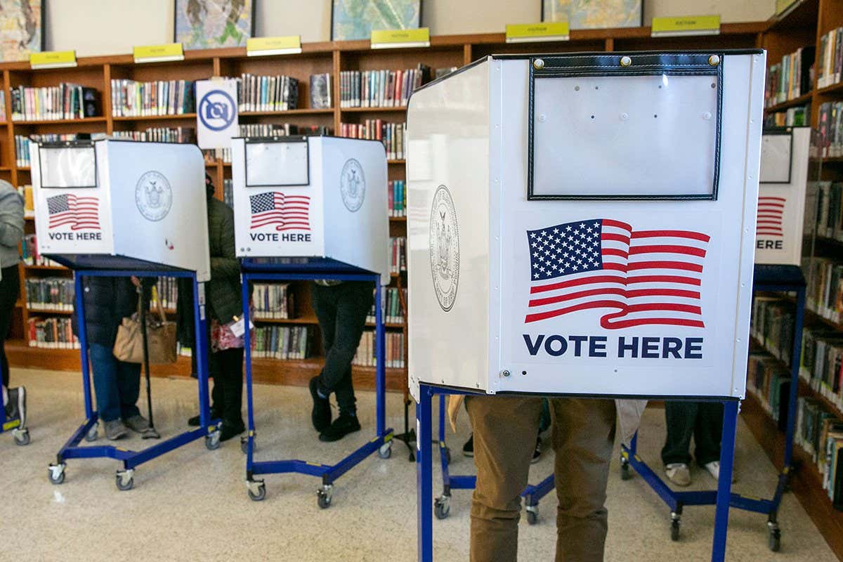 People vote at a polling site in the Central Brooklyn Public Library in the Brooklyn borough of New York, New York, USA