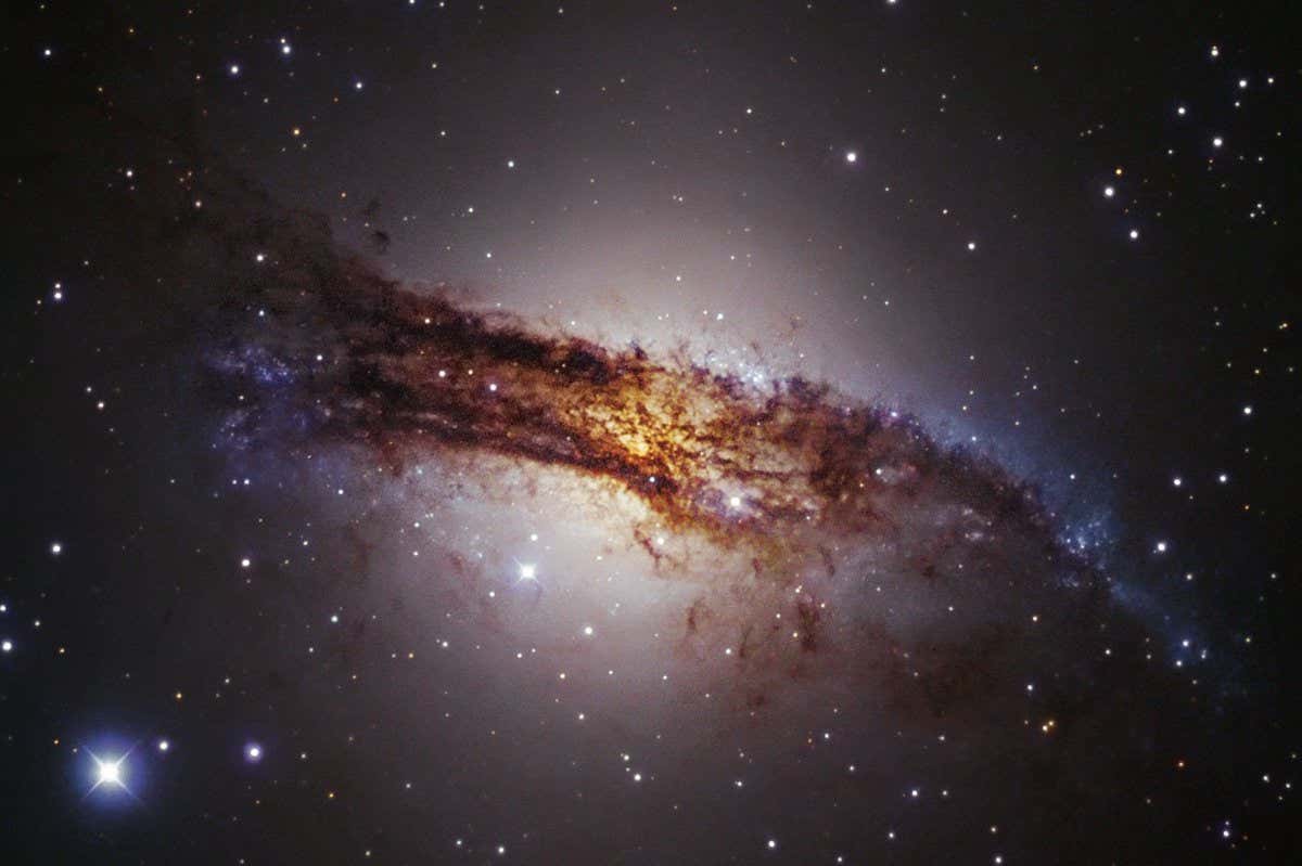 Centaurus A is our nearest giant galaxy, at a distance of about 13 million light-years in the southern constellation of Centaurus, and as such, it is one of the most extensively studied objects in the southern sky. It is an elliptical galaxy, currently merging with a companion spiral galaxy, resulting in areas of intense star formation and making it one of the most spectacular objects in the sky. Centaurus A hosts a very active and highly luminous central region, caused by the presence of a supermassive black hole with a mass of about 100 million solar masses (see eso0109), and is the source of strong radio and X-ray emission. Thick dust layers almost completely obscure the galaxy's centre. This image is based on data acquired with the 1.5-metre Danish telescope at ESO???s La Silla Observatory in Chile, through three filters (B, V, R).