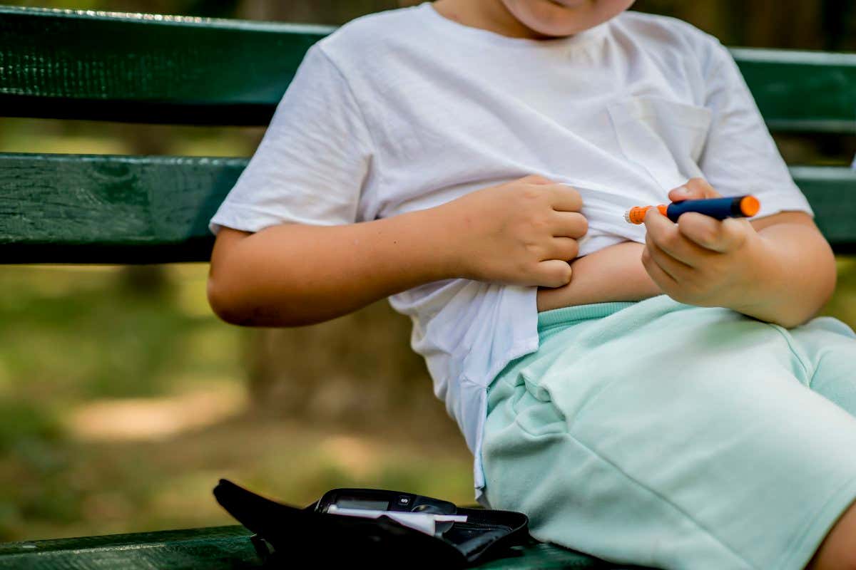 A person with diabetes injecting insulin