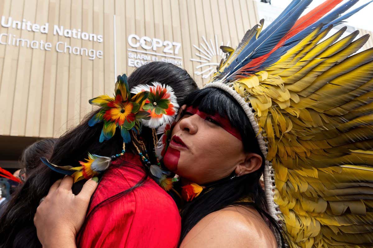 Indigenous women embracing