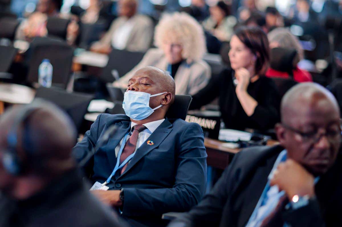 Delegate sleeping at COP27