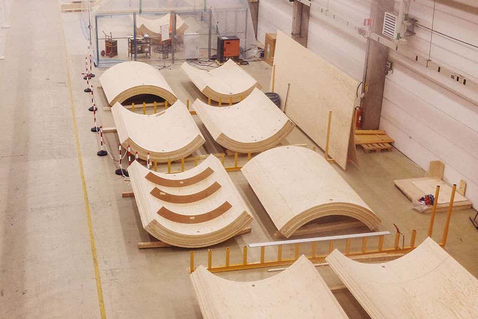 Sections of a timber wind turbine tower under construction