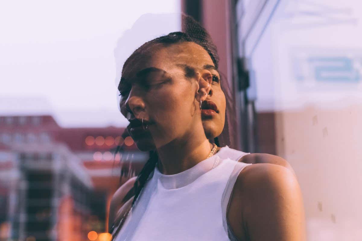 RC8A08 Woman beside glass window