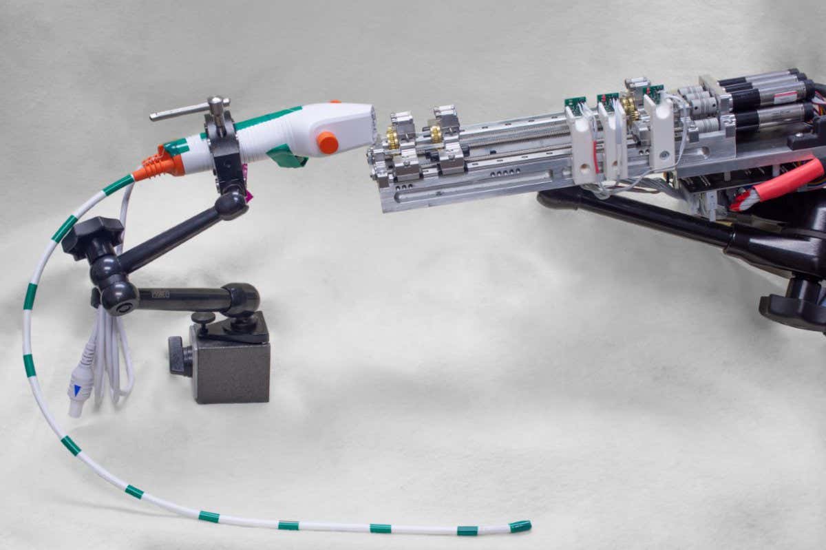 image of the steerable needle robot showing the robotic actuation unit and bronchoscope. Note that the steerable needle is not shown