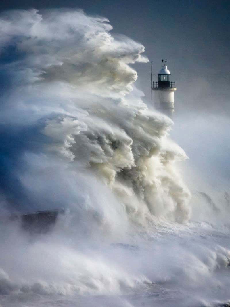 Huge waves rise from the sea at Newhaven during Storm Eunice. The south coast of the UK received its first ever red weather warning due to the approaching storm, Several people died under falling trees and winds reached 122mph at the Isle of Wight. Picture date: Friday February 18, 2022. Photograph by Christopher Ison ? 07544044177 chris@christopherison.com www.christopherison.com IMPORTANT NOTE REGARDING IMAGE LICENCING FOR THIS PHOTOGRAPH: This image is supplied to the client under the terms previously agreed. No sales are permitted unless expressly agreed in writing by the photographer. Sharing with third parties is prohibited without the written permission of the photographer.