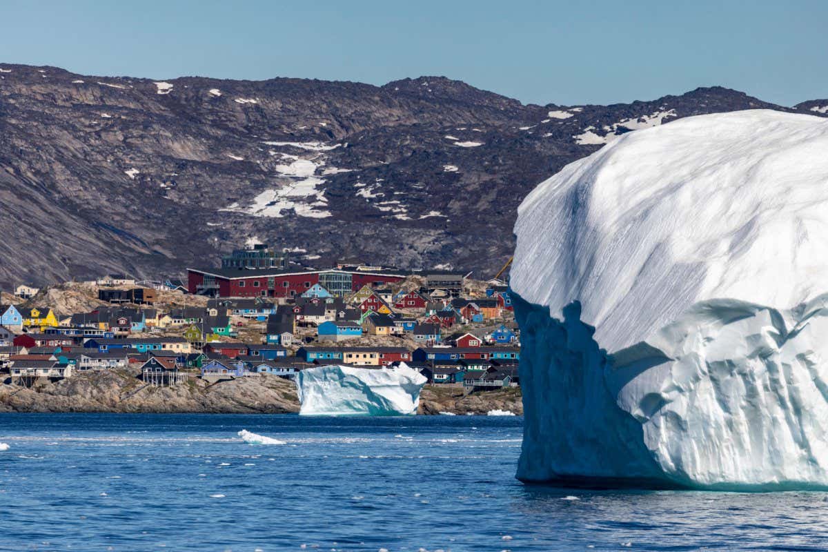 TOPSHOT - Icebergs float in Disko Bay, Ilulissat, western Greenland, on June 28, 2022. - The icebergs originate from Jakobshavn glacier (Sermeq Kujalleq), the most productive glacier in the Northern Hemisphere. The massive icebergs that detach from the glacier float for years in the waters in front of the fjord before being carried south by ocean currents. (Photo by Odd ANDERSEN / AFP) (Photo by ODD ANDERSEN/AFP via Getty Images)