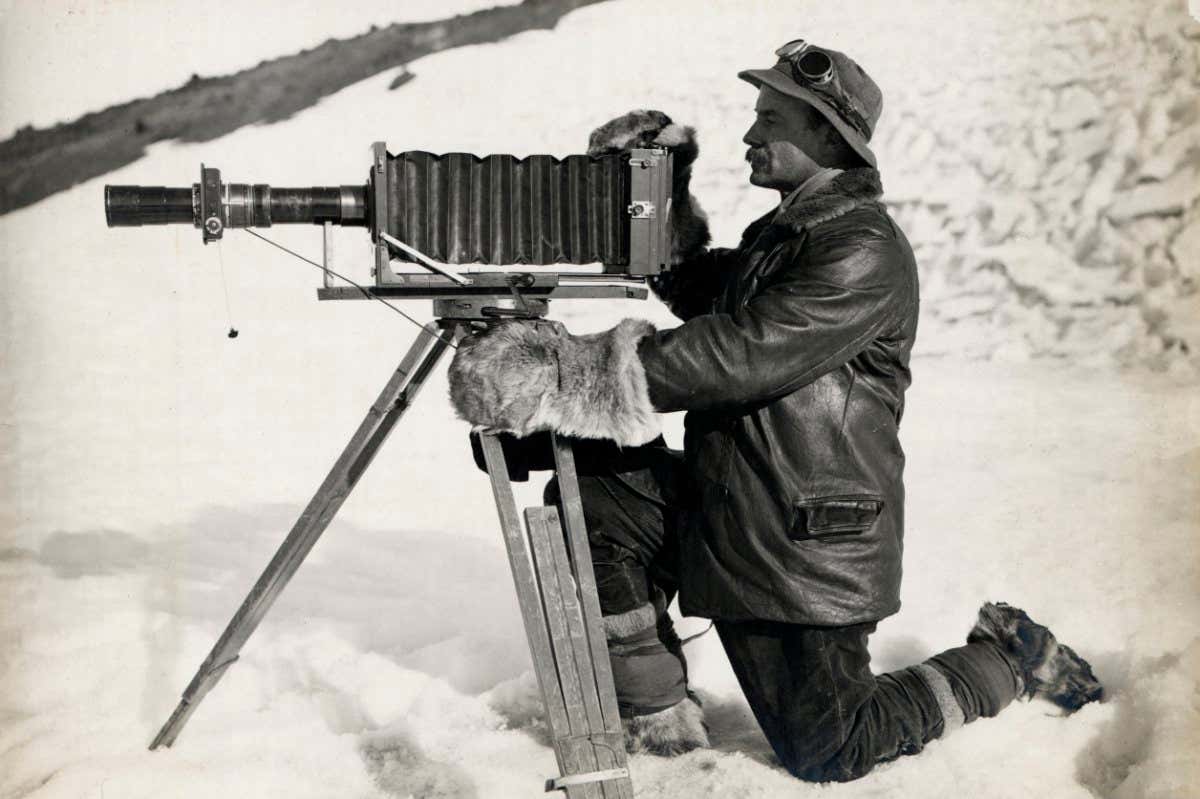 Herbert Ponting and telephoto apparatus, Antarctica, 1912. British Antarctic Expedition 1910-1913. (Photo by Herbert Ponting/Royal Geographical Society via Getty Images)