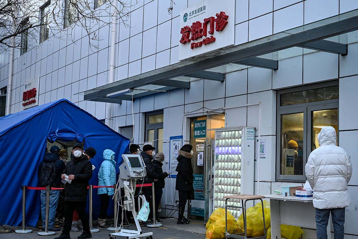 People waiting outside a clinic in Beijing