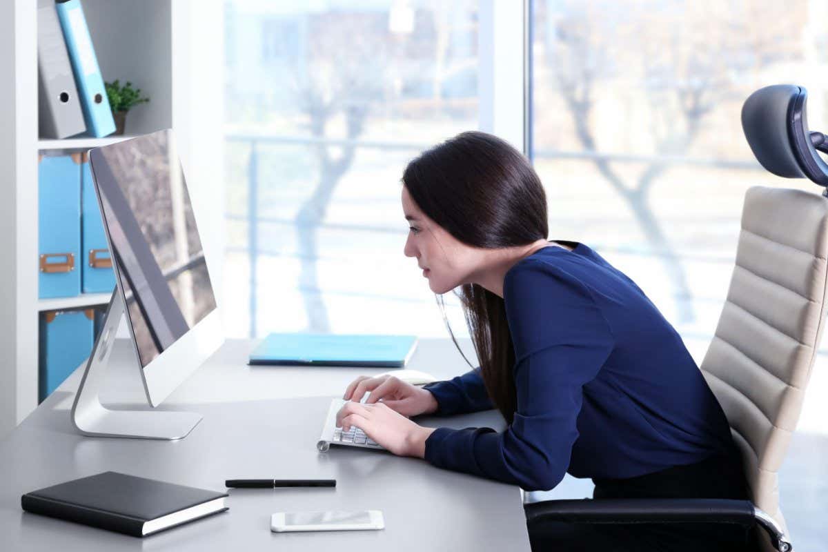 A woman sitting at her desk