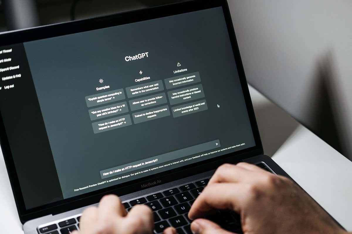 Screen with ChatGPT chat with AI or artificial intelligence. Man search for information using artificial intelligence chatbot