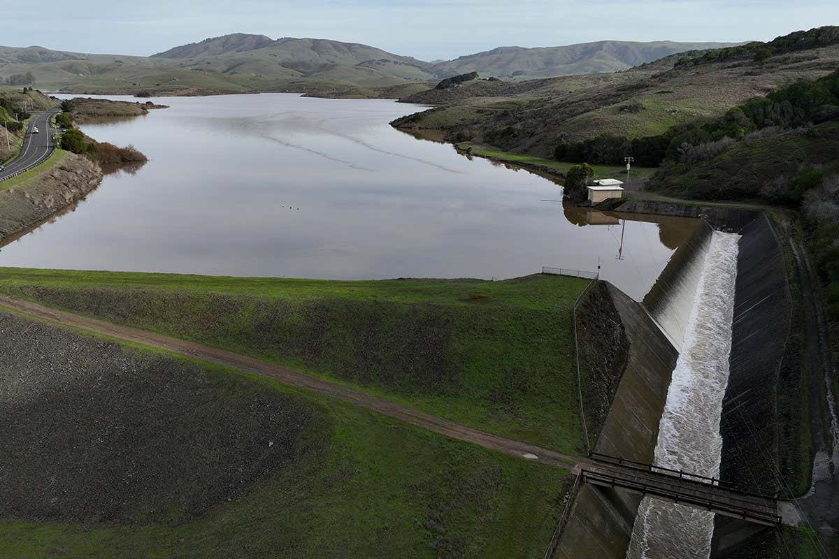 NICASIO, CALIFORNIA - JANUARY 12: In an aerial view, the Nicasio Reservoir is seen at 100 percent capacity after a series of atmospheric river events drenched Northern California on January 12, 2023 in Nicasio, California. As several atmospheric river events bring record rainfall to California, reservoirs across state are seeing their levels rise following several years of extreme drought. Marin County's seven reservoirs are now at 100 percent capacity and other major reservoirs in the state are closing in on historic averages. (Photo by Justin Sullivan/Getty Images)