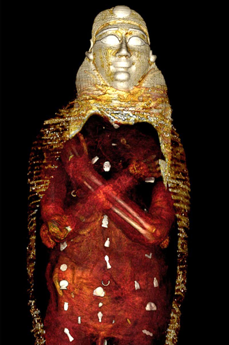 Amulets were placed on or inside the mummy in three columns, including a heart scarab