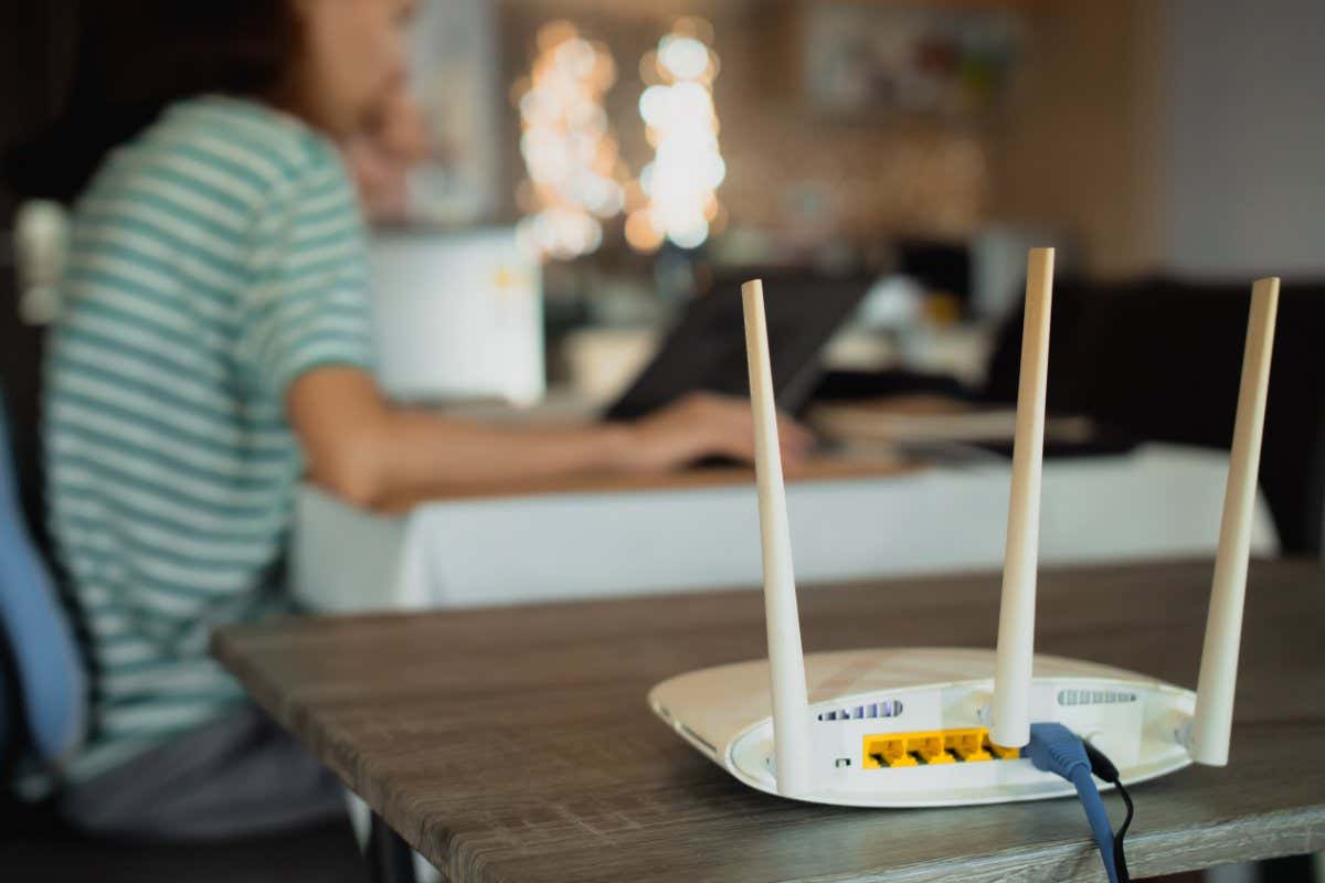 A Wi-Fi transmitter and a woman working in the background