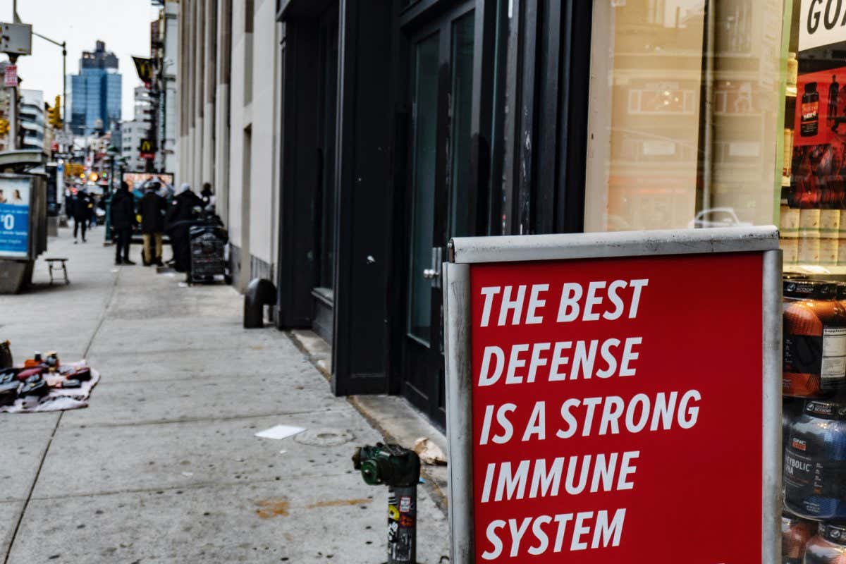 New York, New York - March 14, 2020: The movement and travel restrictions instituted in NYC are having significant economic impacts. A sign at a GNC reads 