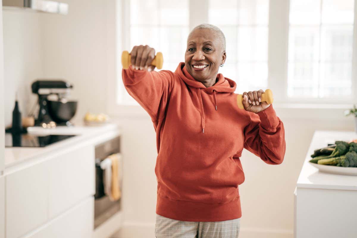 Senior women exercising at home