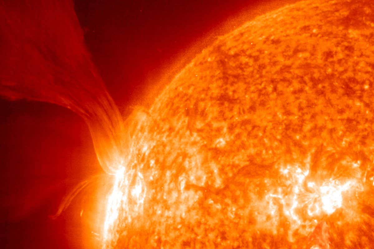 An extensive erupting prominence taken on 15 May, 2001 -- Prominences are huge clouds of relatively cool dense plasma suspended in the Sun's hot, thin corona. At times, they can erupt, escaping the Sun's atmosphere. Emission in this spectral line of EIT 304? shows the upper chromosphere at a temperature of about 60,000 degrees K. The hottest areas appear almost white, while the darker red areas indicate cooler temperatures.