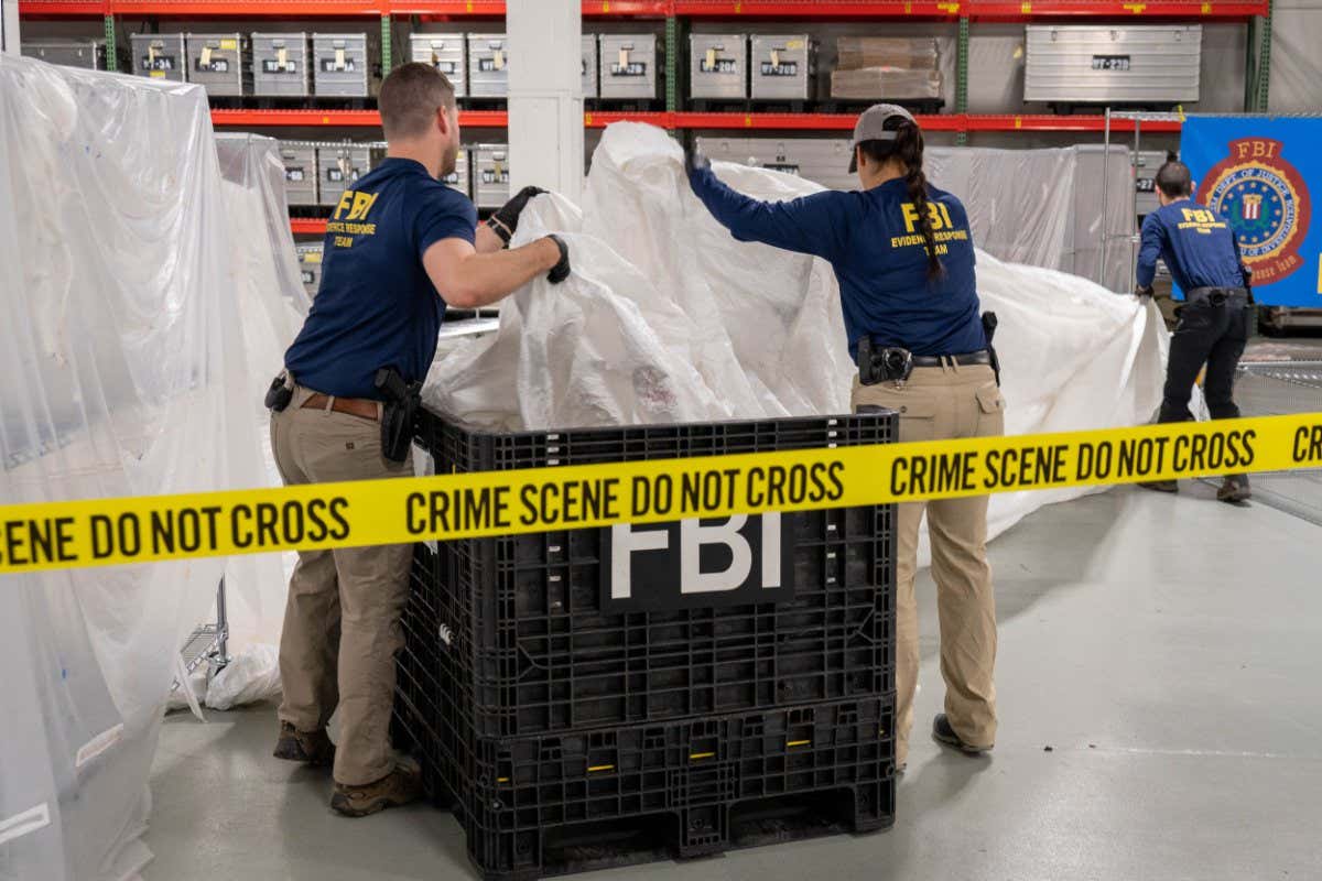Members the FBI with recovered pieces of the Chinese high-altitude balloon that the US shot down on 5 February