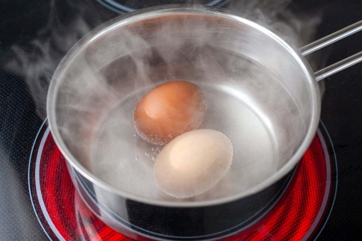 Eggs boiling on an electric stove