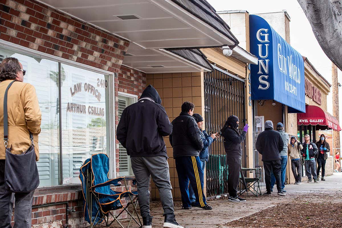 BURBANK, CA - MARCH 17: Shoppers wait in line to purchase ammunition and guns at Gun World in Burbank on Tuesday, March 17, 2020 as US sales of guns and ammunition soar amid the coronavirus outbreak. (Photo by Sarah Reingewirtz/MediaNews Group/Pasadena Star-News via Getty Images)