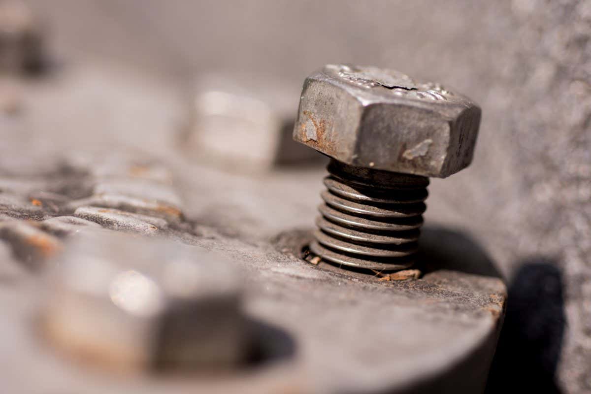 Loosen bolt in daylight close up.; Shutterstock ID 1195047430; purchase_order: -; job: -; client: -; other: -