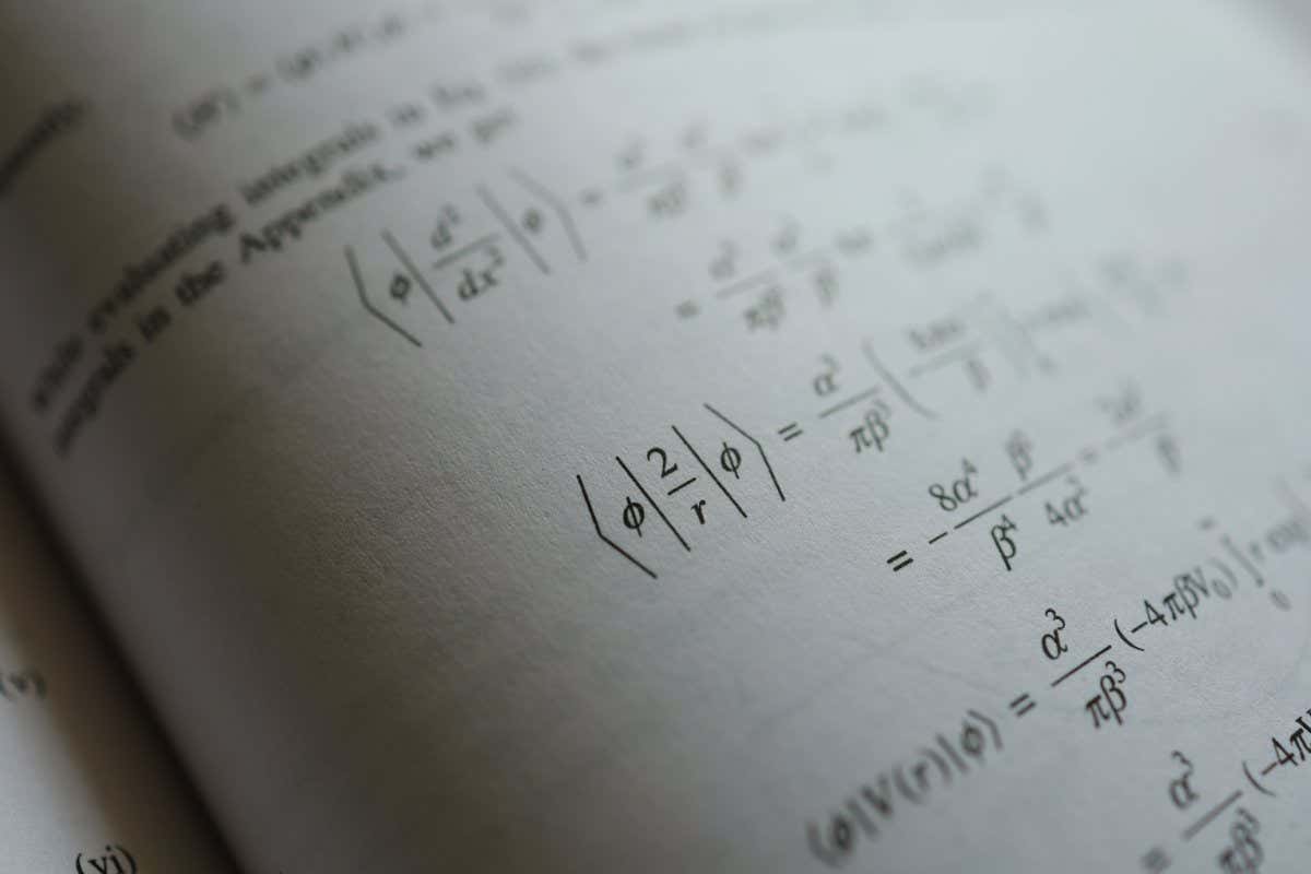 Mathematics equation on quantum mechanic book, selective focus; Shutterstock ID 2181615439; purchase_order: -; job: -; client: -; other: -