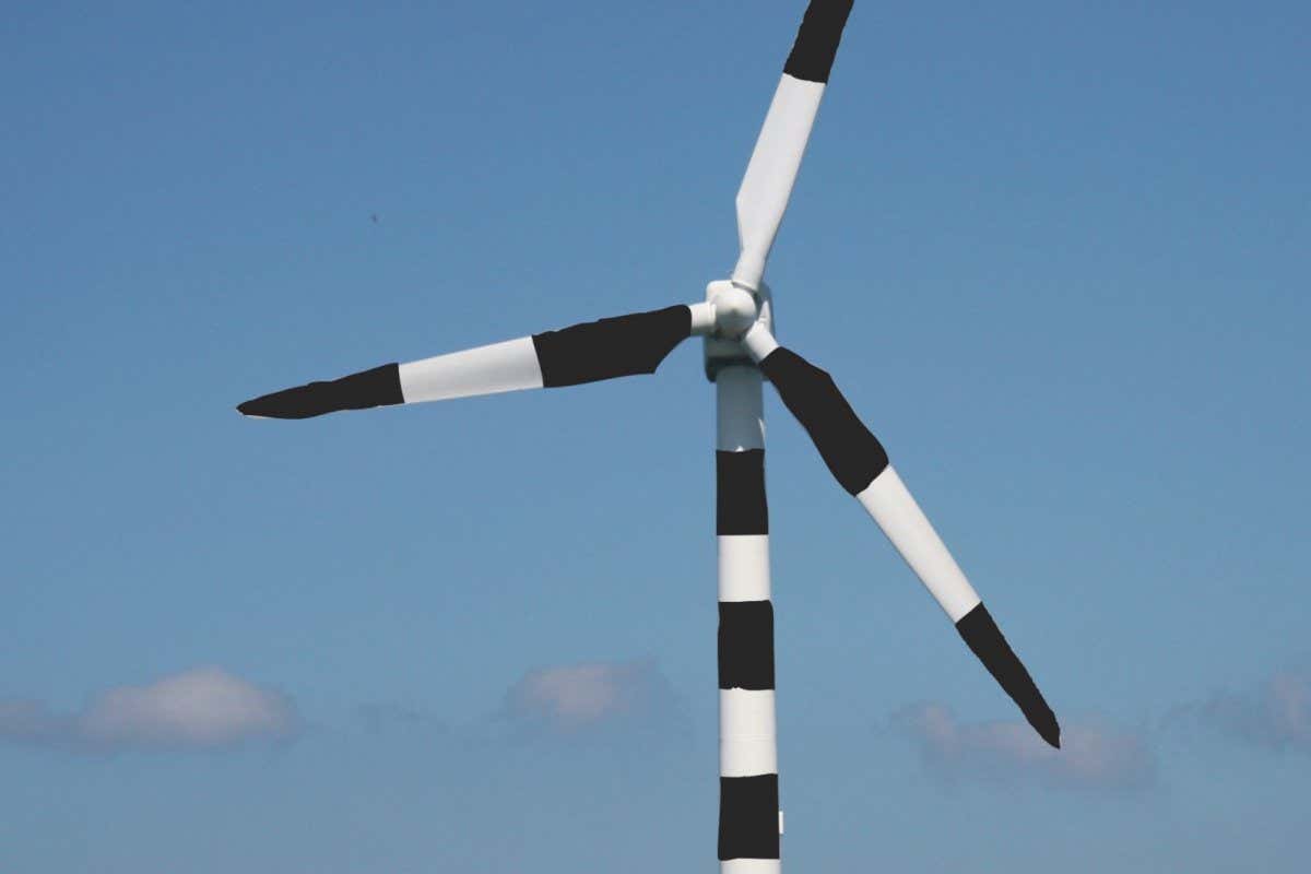 Wind turbine with black and white stripes