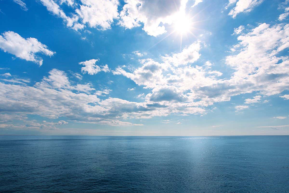 perfect blue sky with clouds and water of the sea
