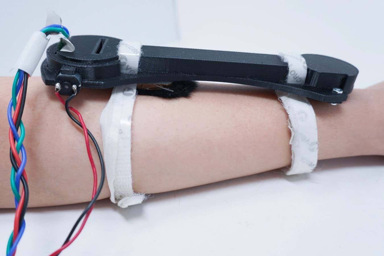 Wearable anti-anxiety device strokes your arm with a furry pompom