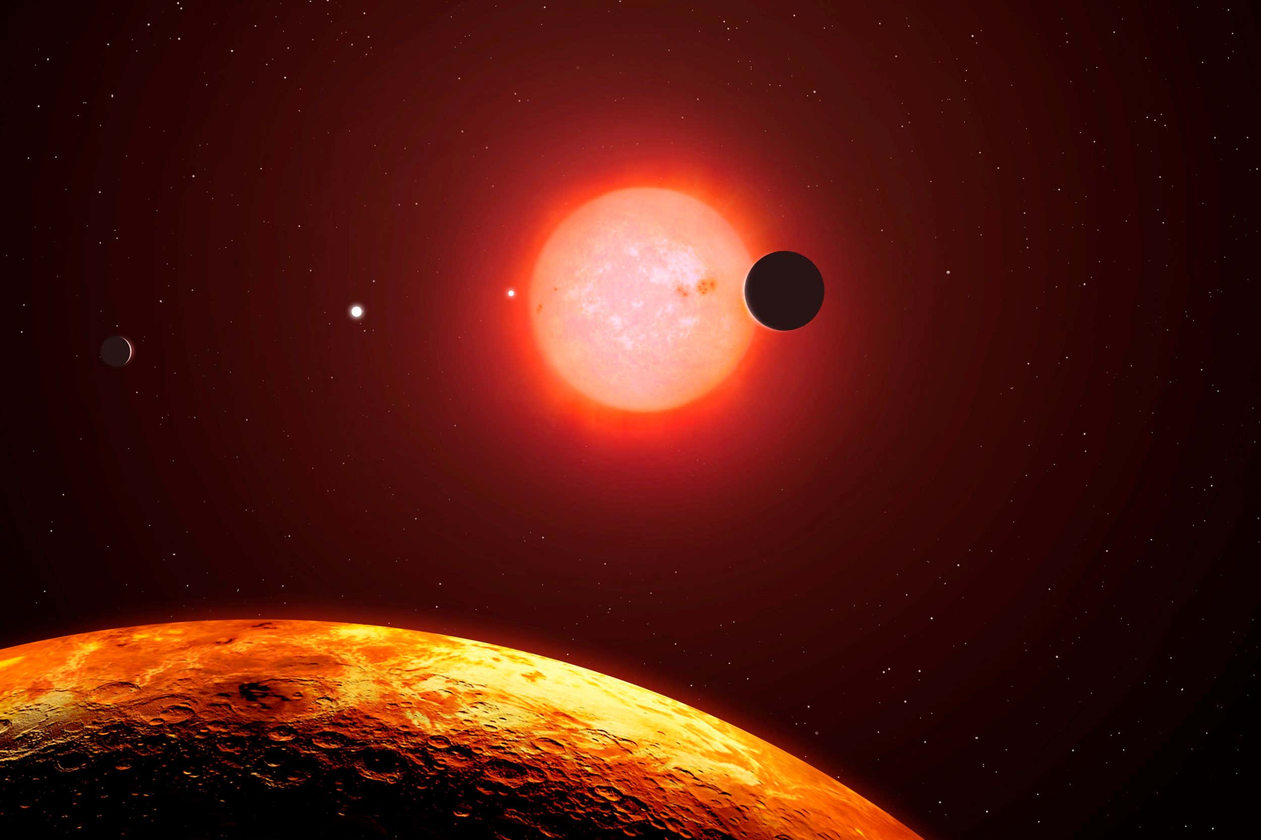 Trappist-1 is a red-dwarf star, the most common variety, located some 40 light-years away in Aquarius. In 2015, astronomers discovered that Trappist-1 was host to three earth-sized planets. Then it came under the spotlight again in 2017 when NASA scientists found an additional four planets, taking the total up to seven. This is the most terrestrial planets that have ever been found to orbit a single star, including our own Solar System. Trappist-1 is only fractionally larger than Jupiter in diameter. This image shows the star and six of the planets as they would appear from the vantage point of the fifth outermost planet, Trappist-1f. All of the planets and the Sun are to scale. One of the worlds is seen transiting in front of the star.