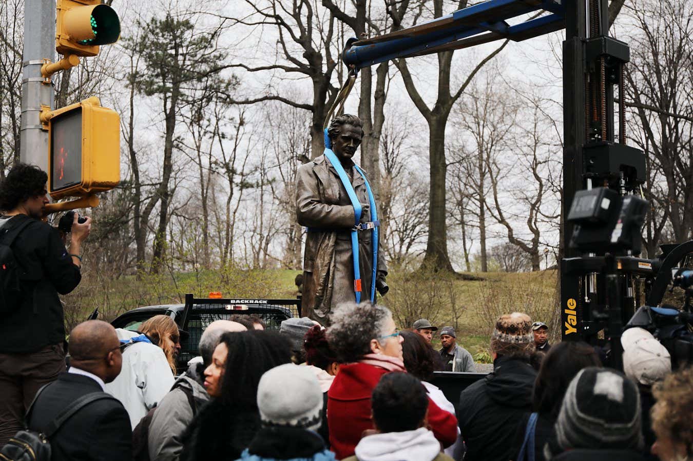 NEW YORK, NY - APRIL 17: A statue of J. Marion Sims, a surgeon celebrated by many as the father of modern gynecology, is driven away in a Parks Department truck after being taken down from its pedestal at Central Park and East 103rd Street on April 17, 2018 in New York City. A New York City panel decided to move the controversial statue after groups demanded its removal as many of Sims medical breakthroughs came from experimenting on black slaves without anesthesia. The statue will be relocated in Green-Wood Cemetery in Windsor Terrace, where Sims is buried. (Photo by Spencer Platt/Getty Images)