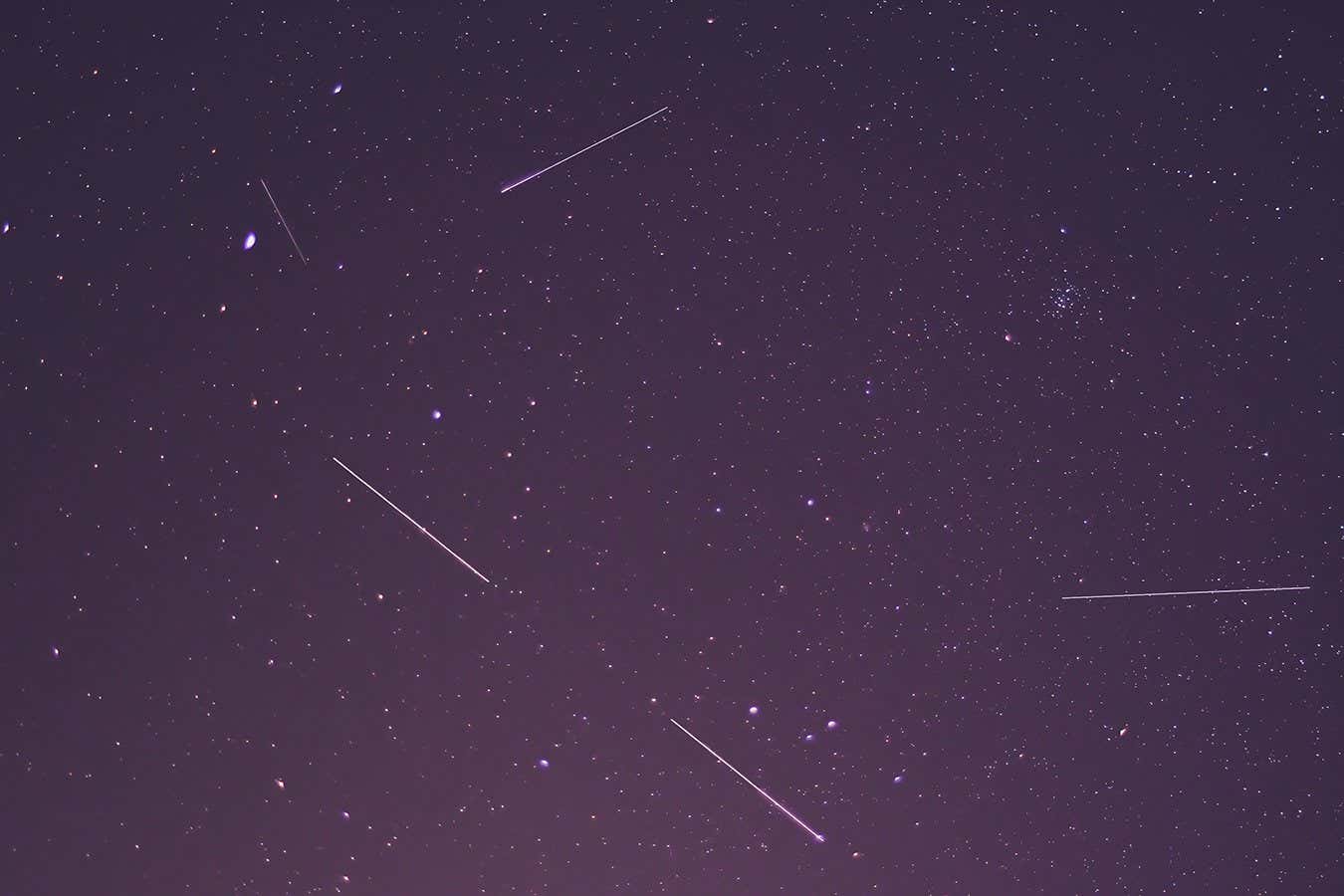 Shooting stars and Starlink stellites leaving streaks in photographs of the night sky