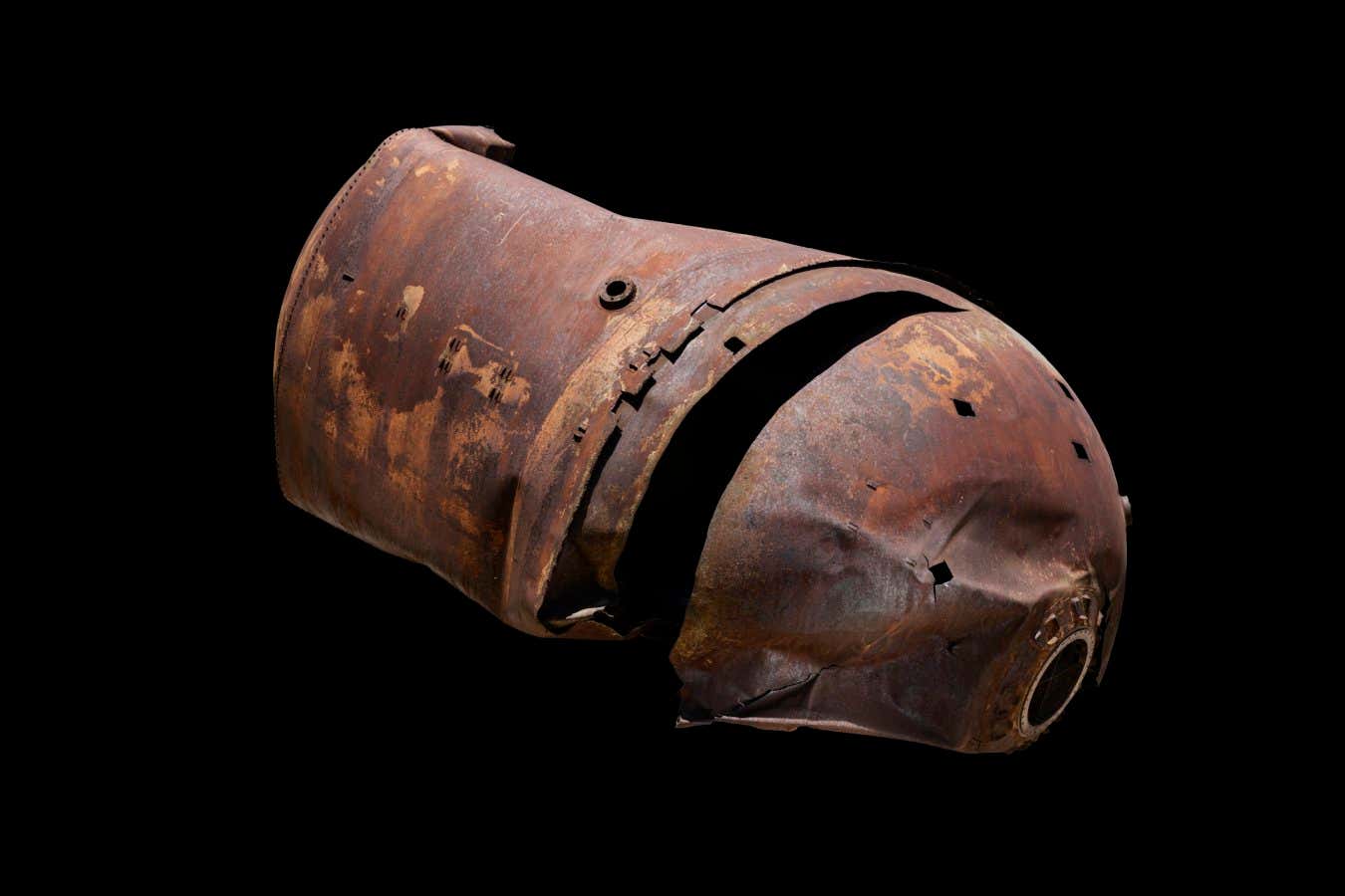 DELTA STAGE 2 FUEL TANK Launched in April 1996, this fuel tank re-entered the Earth?s atmosphere and landed near a Texas farmhouse in January 1997. Metallurgical analysis indicates that it reached a temperature of around 1300?C during re-entry. There are 15 small craters on this tank, made by the impact of micrometeoroids and space debris. A few impacts even penetrated the tank wall.