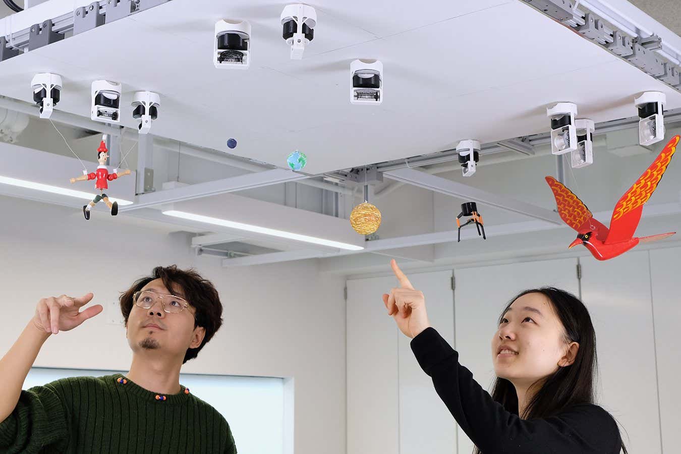 These robots use magnets to cling to the ceiling