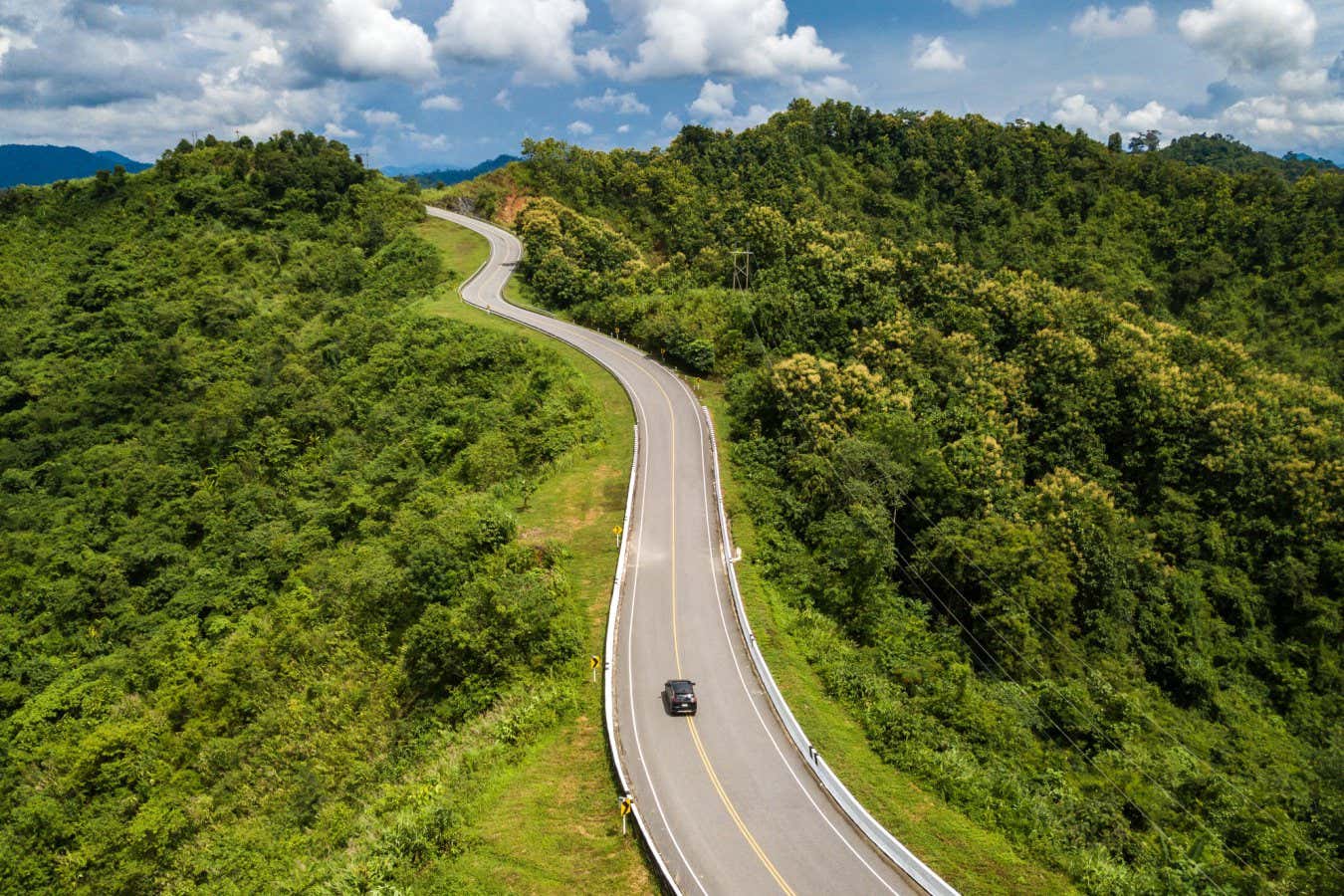 Aerial view of car driving on beautiful steep curved road (look like number 3) on the high mountain in Nan province, Thailand.; Shutterstock ID 1815816242; purchase_order: -; job: -; client: -; other: -