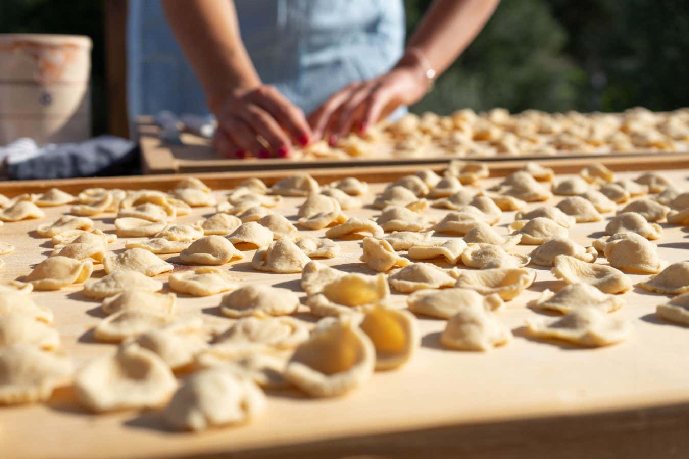 Ostuni, Puglia, Italy - 05 20 2022: Preparation of typical handmade pasta called 