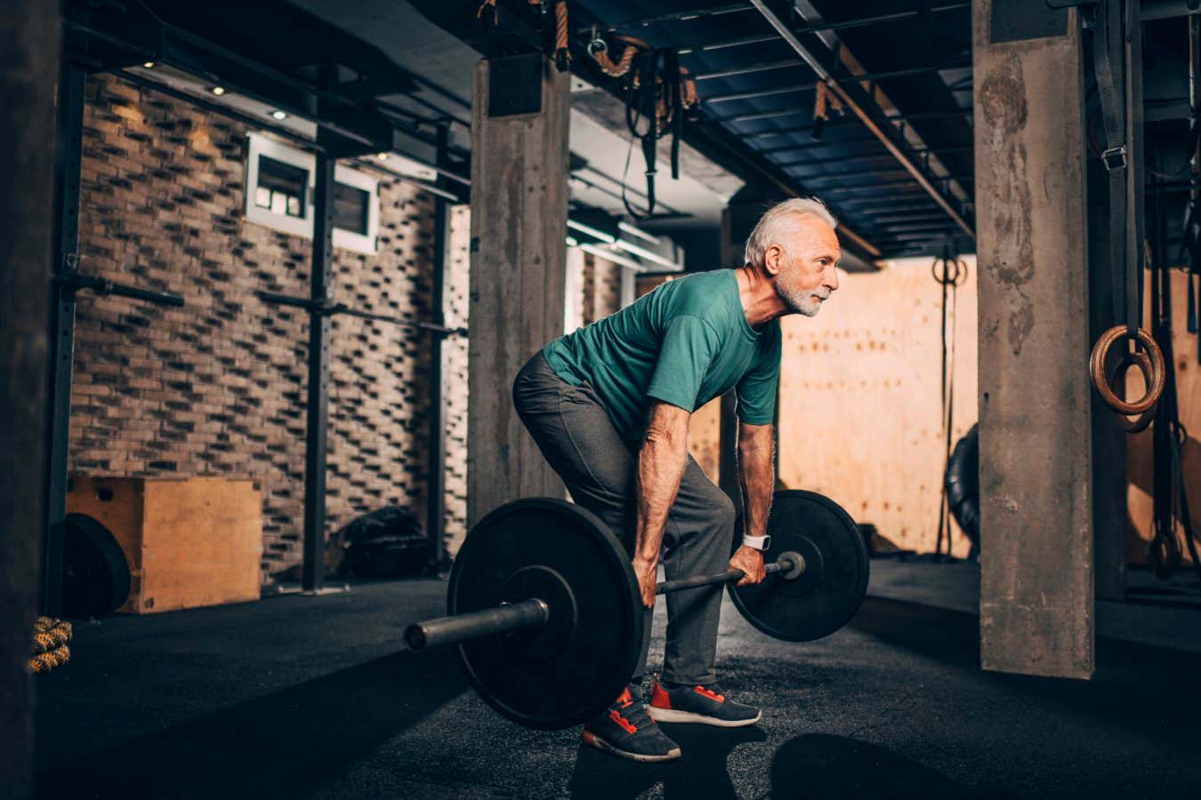 An older man weight training