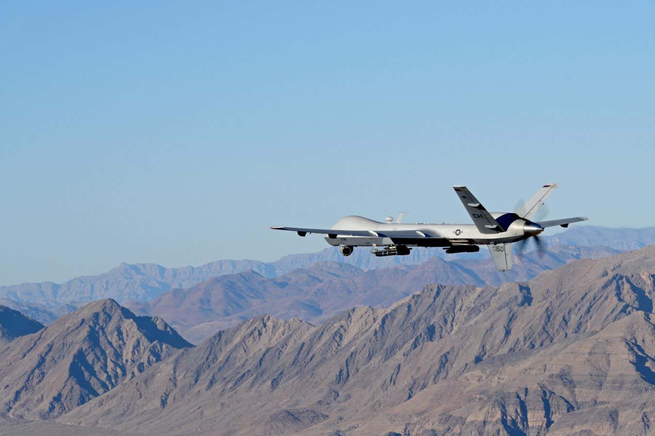 W63DR9 Creech and Nellis Airmen coordinated a training flight together on the Nevada Test and Training Range, July 15, 2019. Aircrew with the 66th Rescue Squadron conducted training exercises and integrated with the MQ-9 Reaper aircrew to document the Reaper in flight. (U.S. Air Force photo by Senior Airman Haley Stevens)