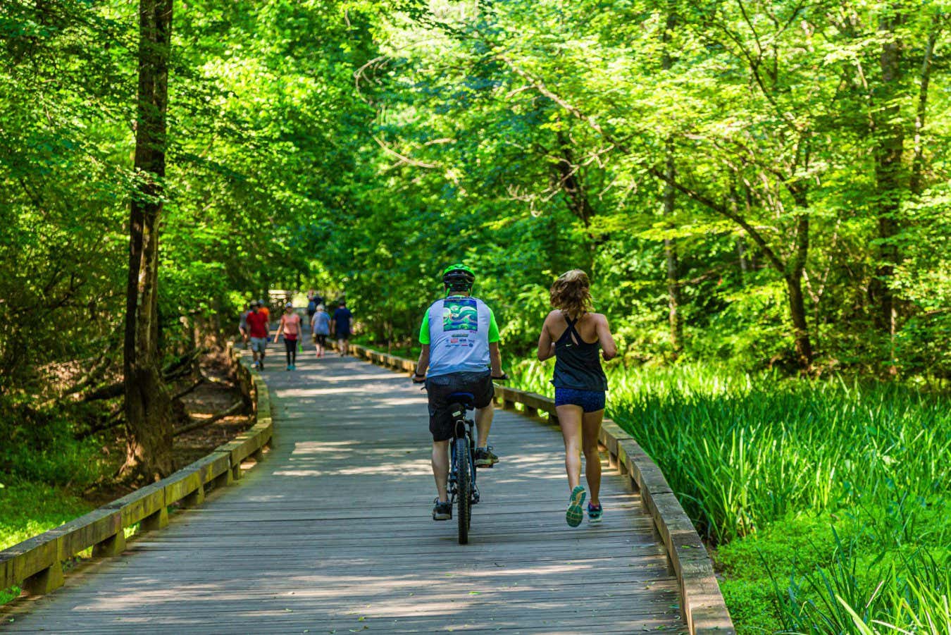 2AFPK7B Cyclist and Runner on Trail