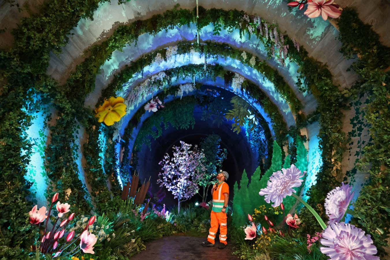 Engineer Jason Lyon poses as he views Loo Garden, a temporary subterranean garden designed to represent a future healthier River Thames, in a section of the Thames Tideway Tunnel - commonly known as the 'Super Sewer' - a 25 kilometre tunnel being built across London under and along the River Thames to deal with combined sewer overflows currently polluting the river, in London, Britain, June 29, 2023. REUTERS/Toby Melville - RC22T1ANLLXT