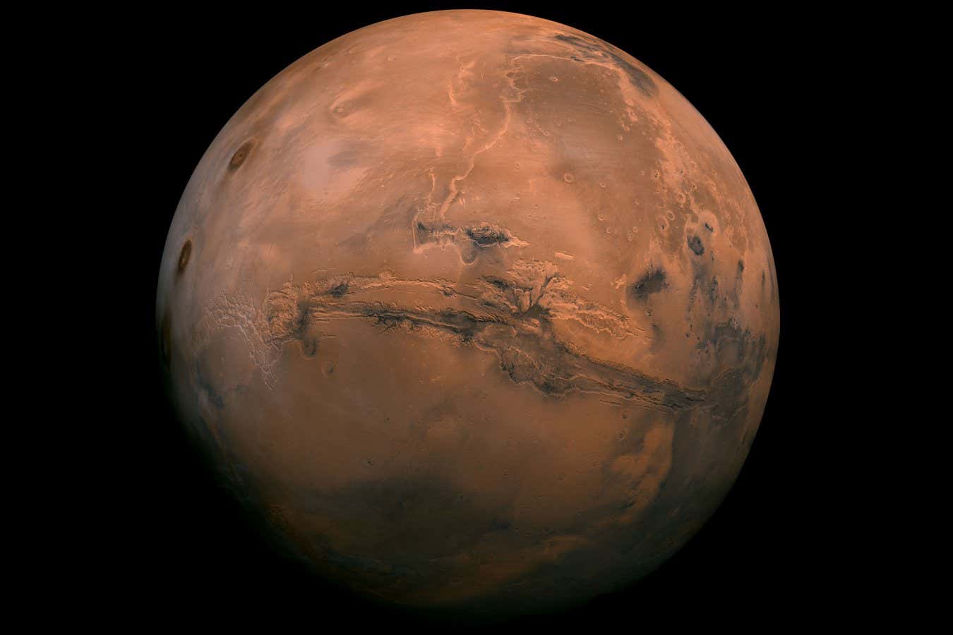 This mosaic of Mars is a compilation of images captured by the Viking Orbiter 1. The center of the scene shows the entire Valles Marineris canyon system, more than 2,000 miles (3,000 kilometers) long, 370 miles (600 kilometers) wide and 5 miles (8 kilometers) deep, extending from Noctis Labyrinthus, the arcuate system of graben to the west, to the chaotic terrain to the east.