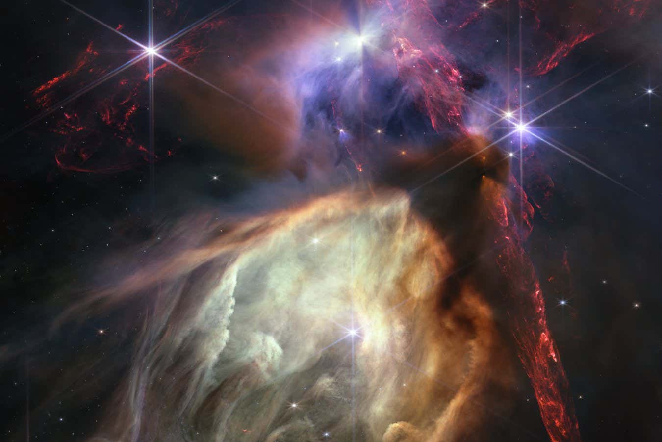 Caption The first anniversary image from NASA?s James Webb Space Telescope displays star birth like it?s never been seen before, full of detailed, impressionistic texture. The subject is the Rho Ophiuchi cloud complex, the closest star-forming region to Earth. It is a relatively small, quiet stellar nursery, but you?d never know it from Webb?s chaotic close-up. Jets bursting from young stars crisscross the image, impacting the surrounding interstellar gas and lighting up molecular hydrogen, shown in red. Some stars display the telltale shadow of a circumstellar disk, the makings of future planetary systems. The young stars at the center of many of these disks are similar in mass to the Sun, or smaller. The heftiest in this image is the star S1, which appears amid a glowing cave it is carving out with its stellar winds in the lower half of the image. The lighter-colored gas surrounding S1 consists of polycyclic aromatic hydrocarbons, a family of carbon-based molecules that are among the most common compounds found in space. For more detail on what is happening where in Webb?s image of Rho Ophiuchi, watch the video tour and read the press release. Credits Image NASA, ESA, CSA, STScI, Klaus Pontoppidan (STScI) Image Processing Alyssa Pagan (STScI)