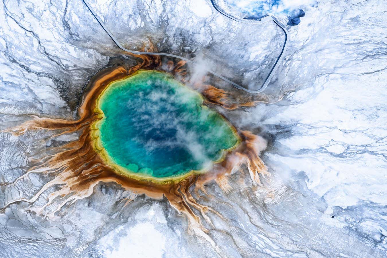 Aerial view of Grand prismatic spring in Yellowstone national park in Winter, Taken from a small plane, Wyoming, USA; Shutterstock ID 1378285802; purchase_order: -; job: -; client: -; other: -