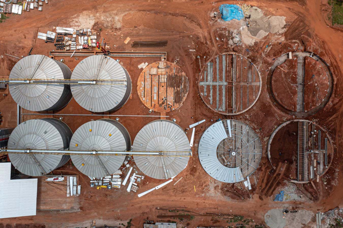 Grain silo building site in San Ignacio de Velasco. In the last two decades, the rate of primary forest loss in Bolivia has roughly doubled. The turning point was in 2015 when Evo Morales' government issued a decree allowing the clearing of 20 hectares of forest on small plots without permits to increase food security in the country. San Ignacio de Velasco, Bolivia 2022