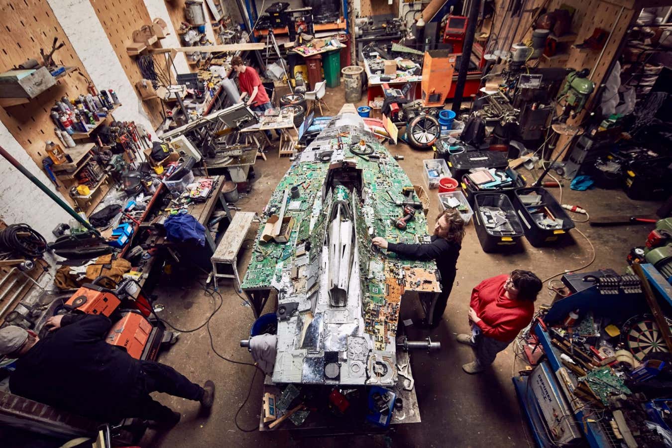 Artist Liam Hopkins working on the Recover-e car