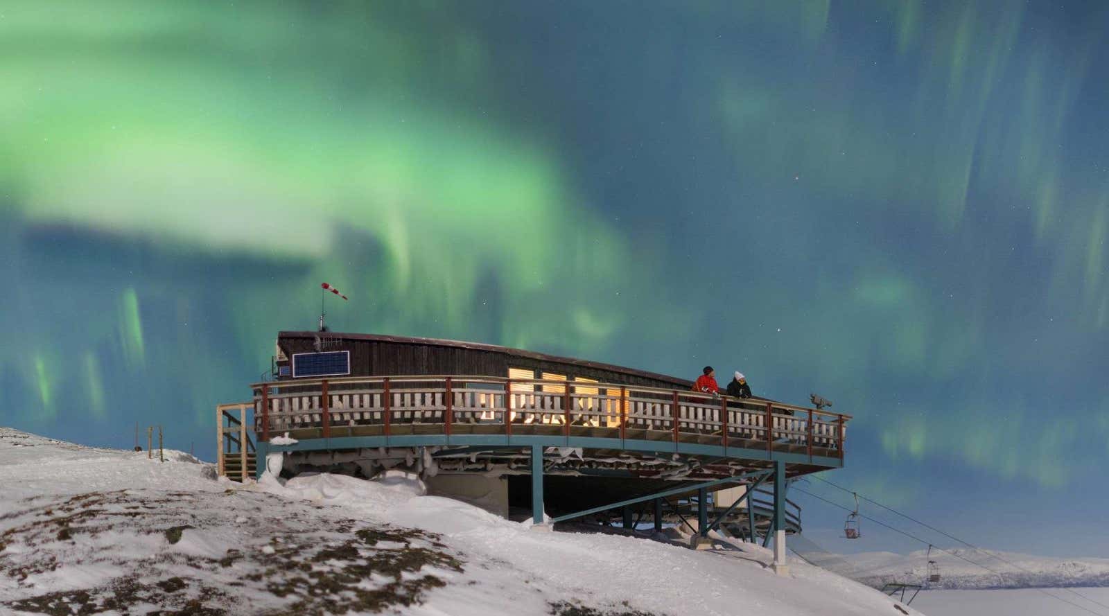 Abisko aurora sky station with Northern lights above, Abisko National Park, Sweden