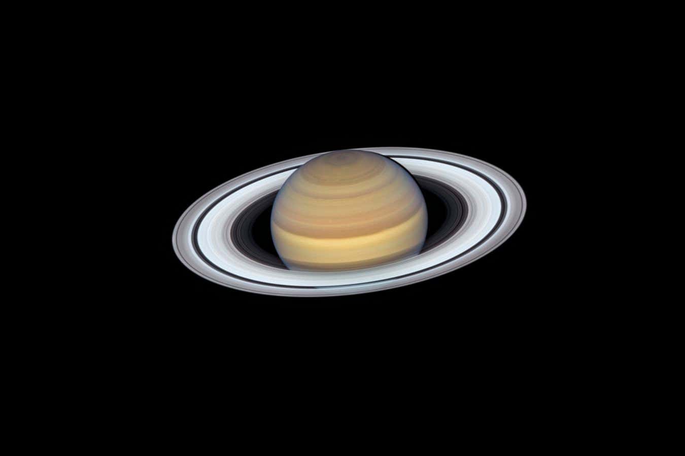 Release Date September 12, 2019 10:00AM (EDT) Caption Anyone who has ever peered at Saturn through a small telescope is immediately enticed by its elegant rings, which make the far-flung planet one of the most exotic-looking, opulent worlds in the solar system. The latest view of Saturn from NASA's Hubble Space Telescope captures exquisite details of the ring system?which looks like a phonograph record with grooves that represent detailed structure within the rings?and atmospheric details that once could only be captured by spacecraft visiting the distant world. One such intriguing feature is the long-lasting hexagon-shaped structure circling the planet's north pole. It is a mysterious six-sided pattern caused by a high-speed jet stream. NASA's Voyager 1 spacecraft first discovered the 