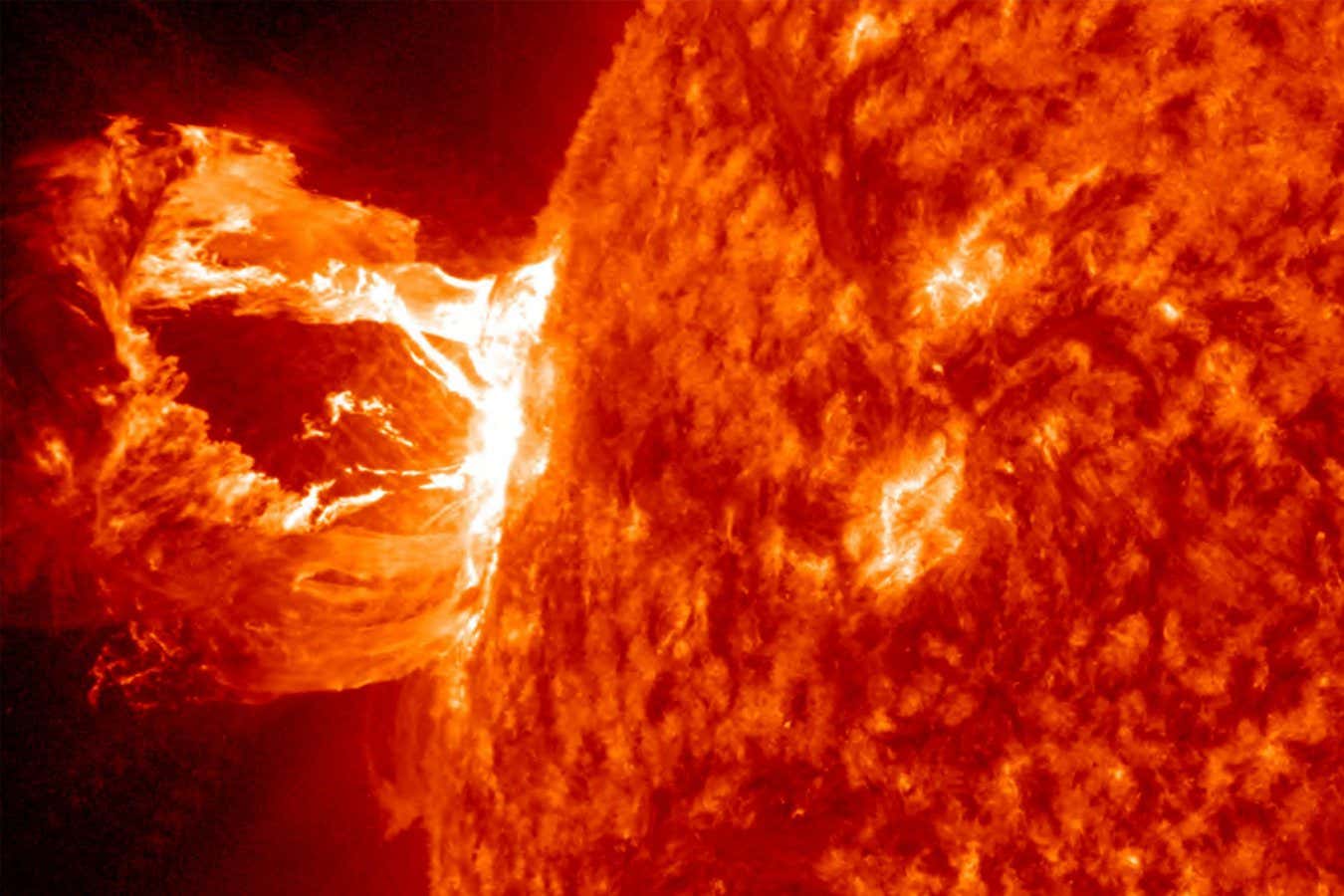 A solar flare, a tremendous explosion on the sun that happens when energy stored in 