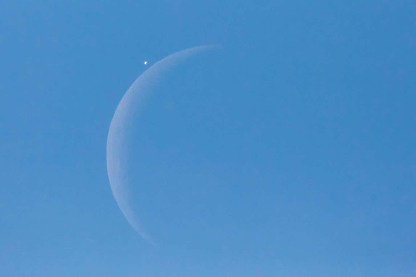 Venus seen next to the crescent moon just before a daytime occultation in 2015